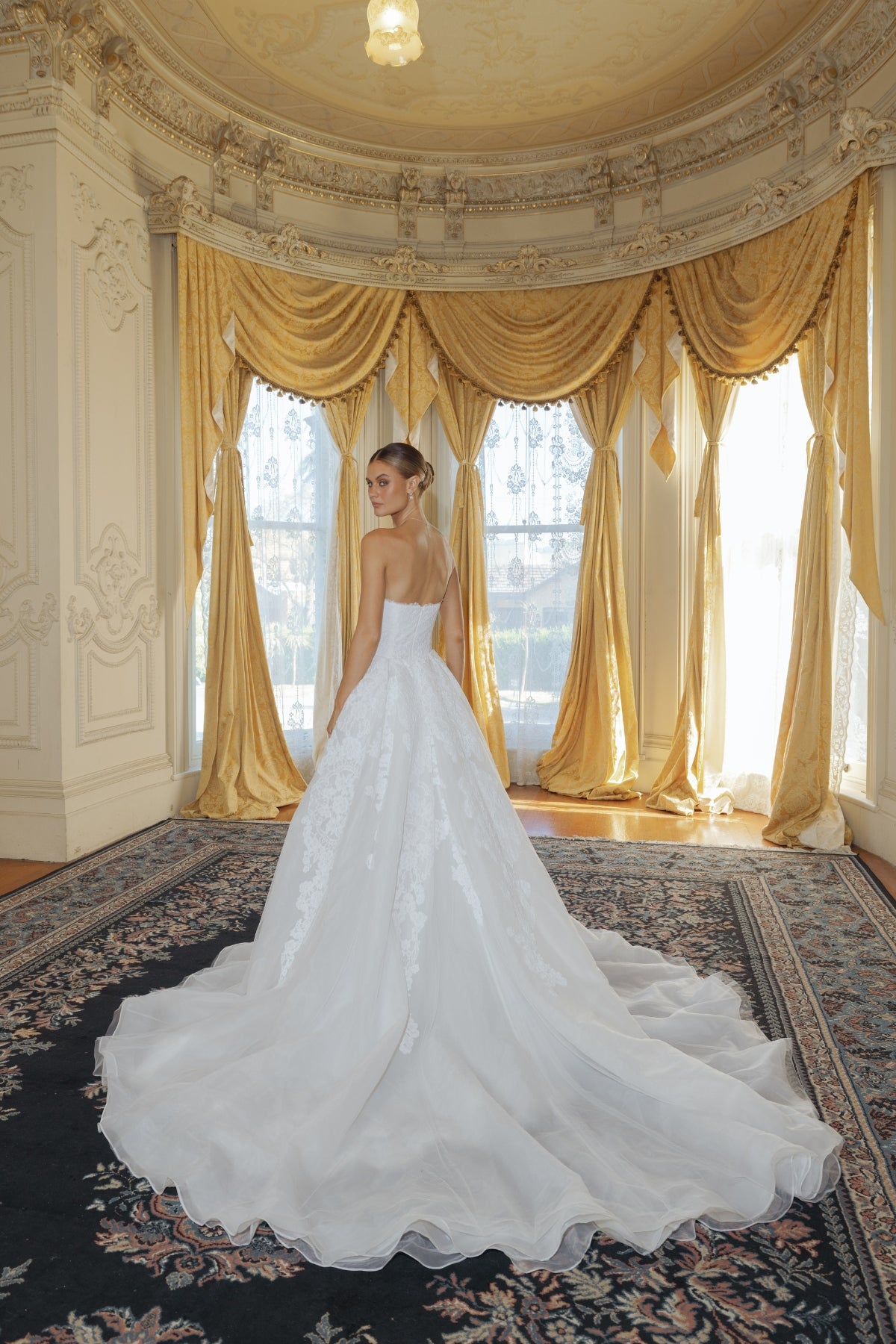 fitted lace wedding gown with sweetheart neckline and scalloped train 