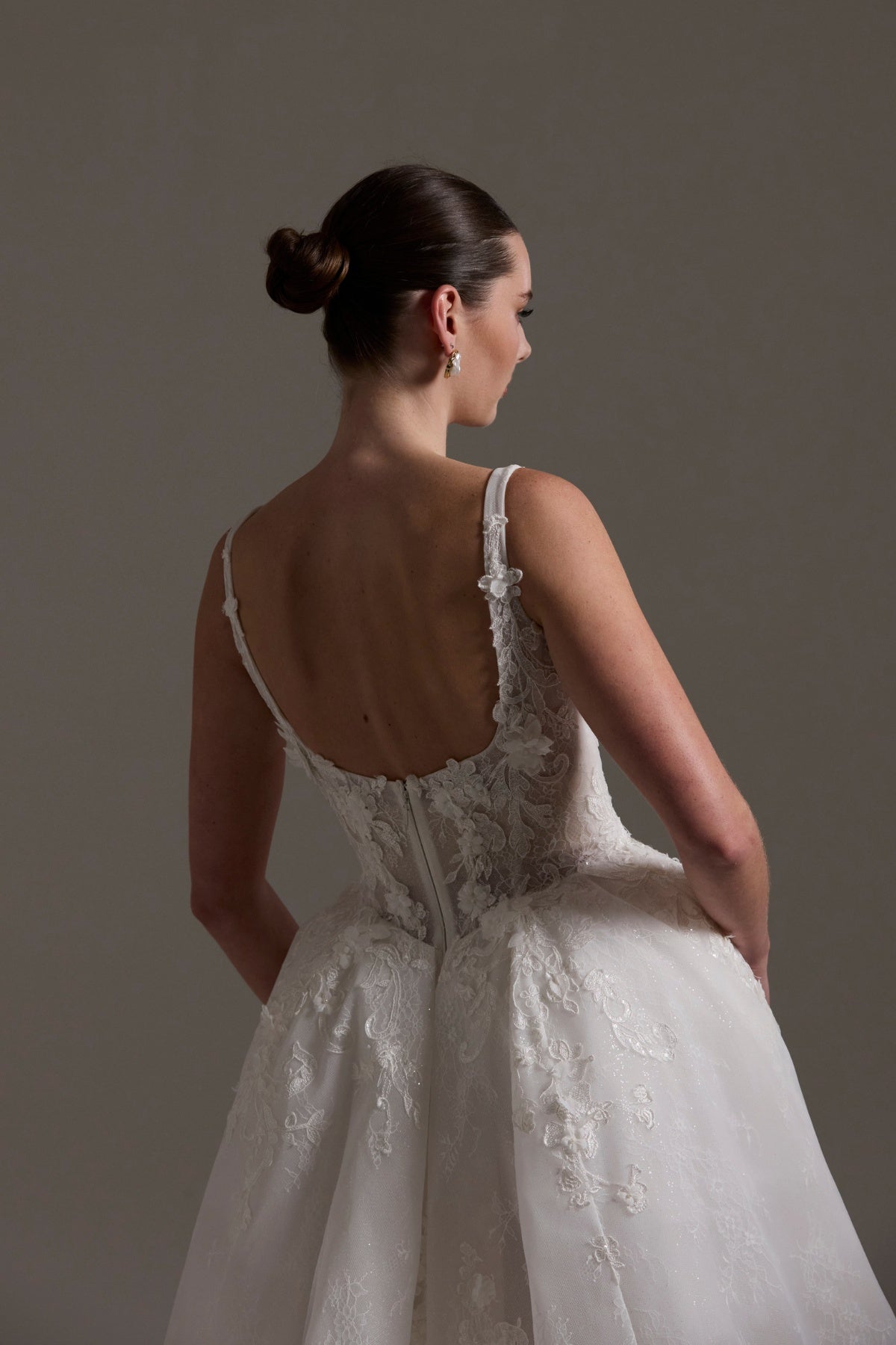 A-line Wedding gown featuring a square neckline, ballgown skirt, and lace. 