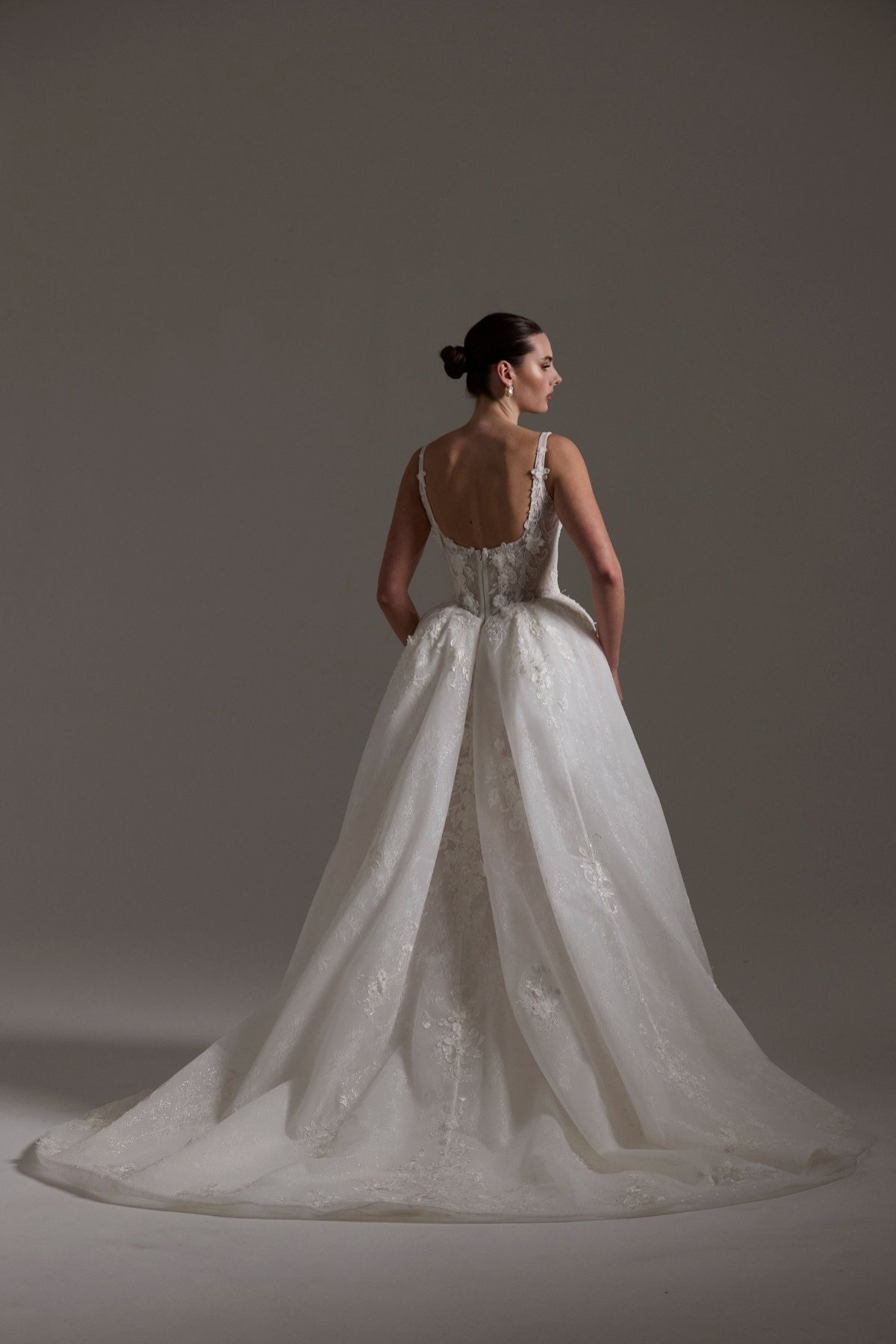 A-line Wedding gown featuring a square neckline, ballgown skirt, and lace. 