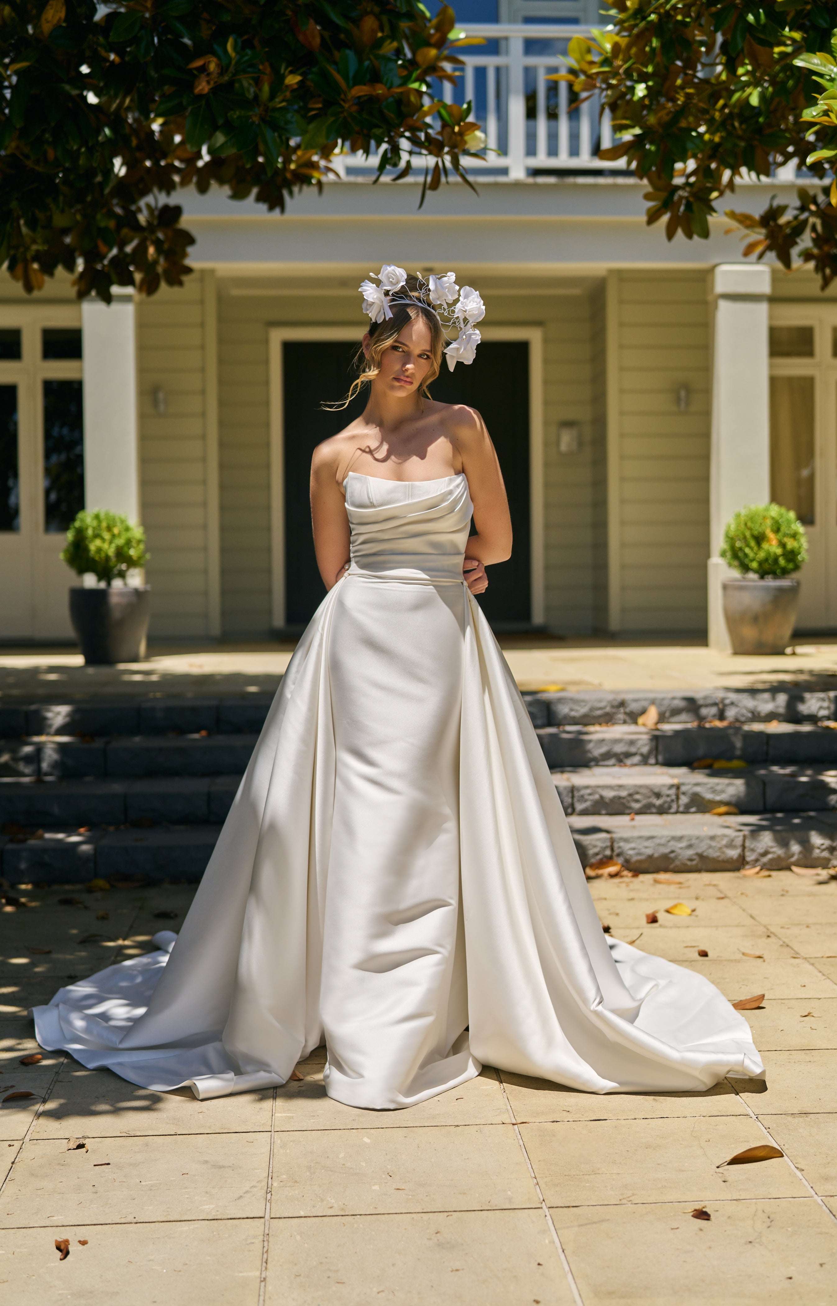 Model wears mikado wedding dress with Lisha overskirt. A detachable overskirt with lots of volume that trails behind.