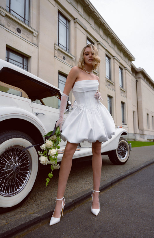 Mini wedding gown with bubble skirt and mini bows. Corseted Bodice with Ruched bust. 