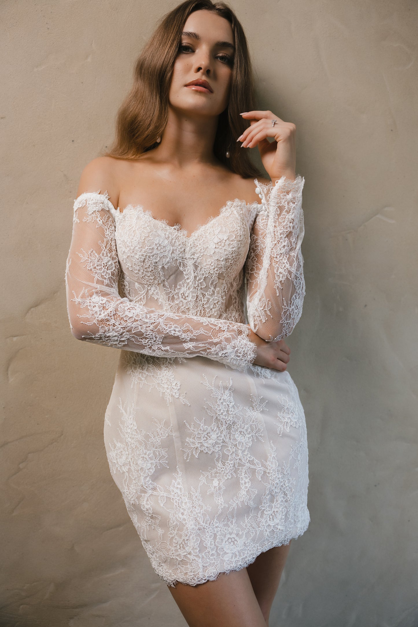 Bridal gown Lillian is a vintage-inspired mini with delicate lace, perfect for champagne celebrations late into the night. By Roselle Collection Jessica Couture.
