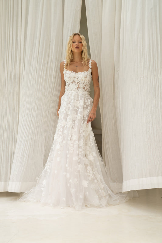 A-line wedding dress covered in 3D floral lace, square neckline with straps. 
