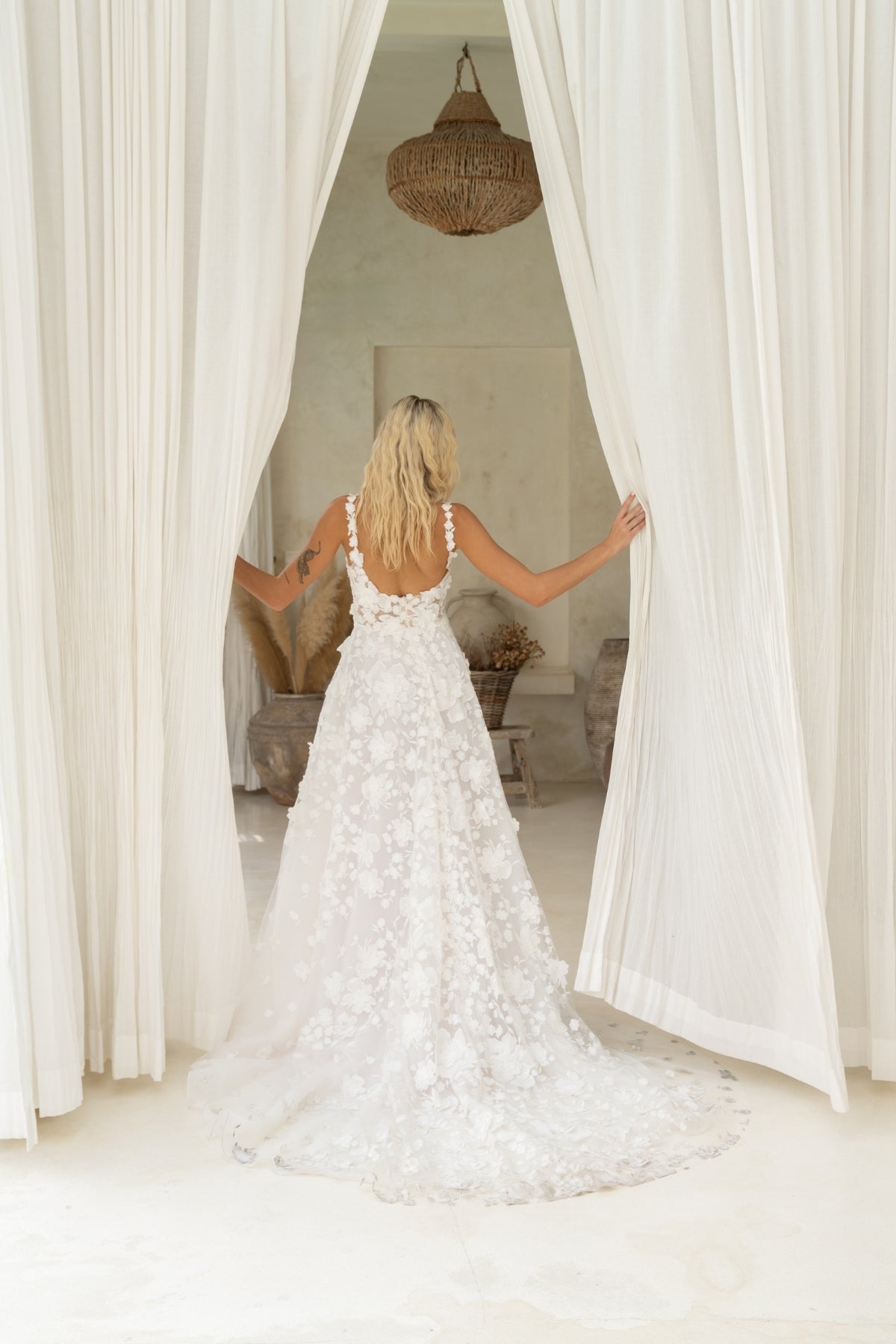 A-line wedding dress covered in 3D floral lace, square neckline with straps. 