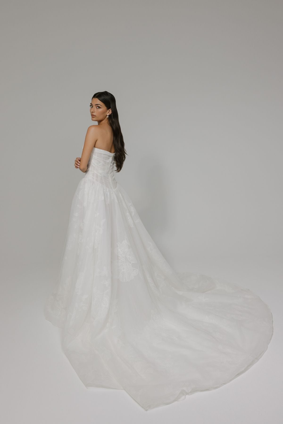 A-line wedding gown, subtle floral pattern, strapless corset boning bodice. 
