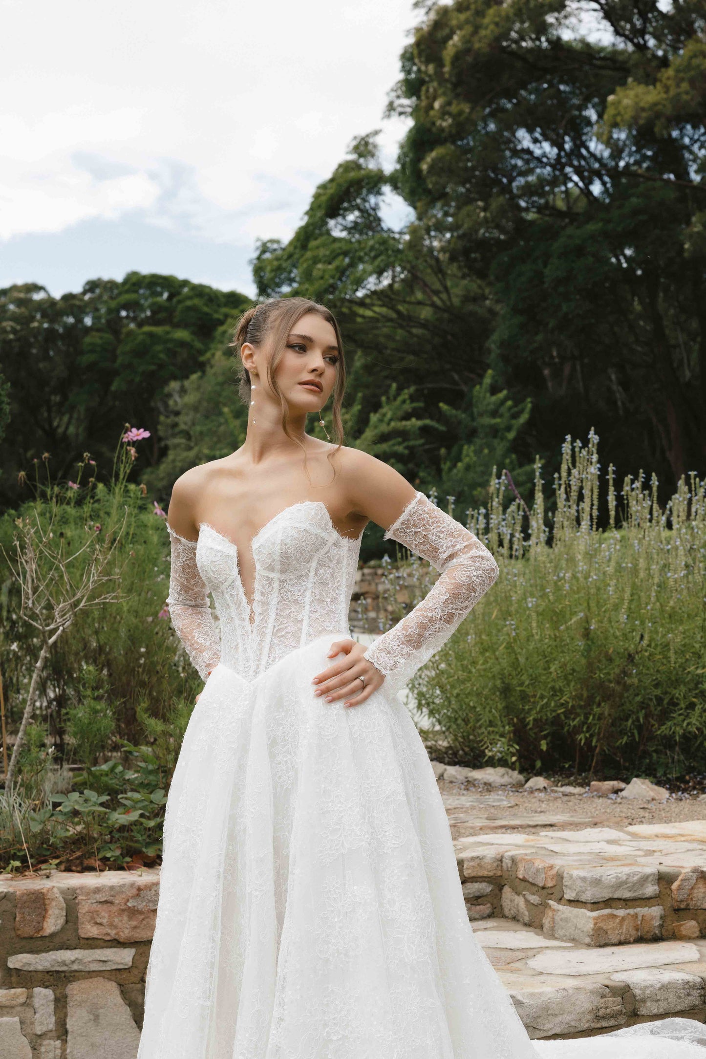 Caitlyn Gown – A-line bridal lace dress with a chapel train, matching lace gloves, and a V-plunge by Roselle collection Jessica Couture
