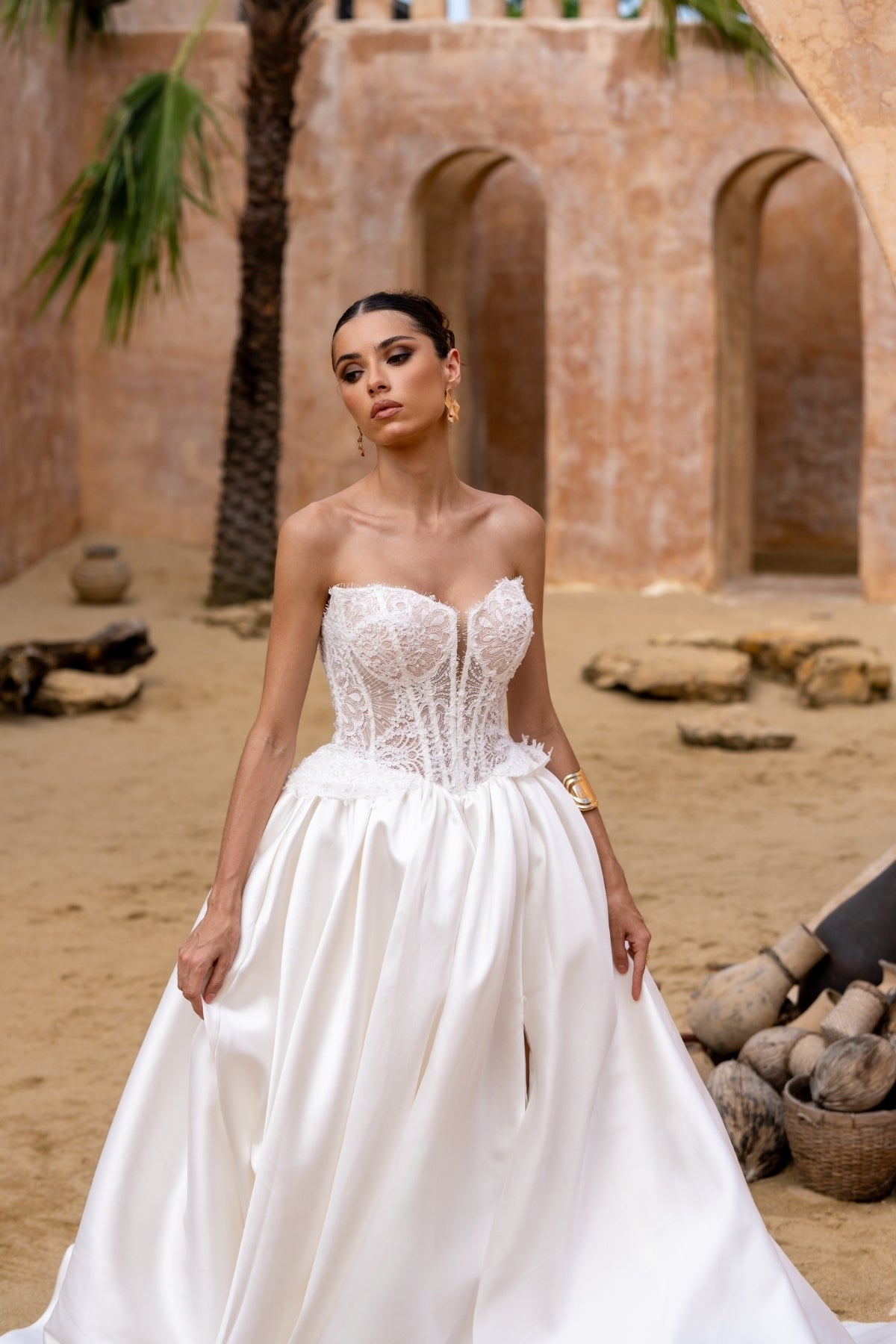 A-line wedding gown with lace bodice and plain skirt featuring basque waistline 