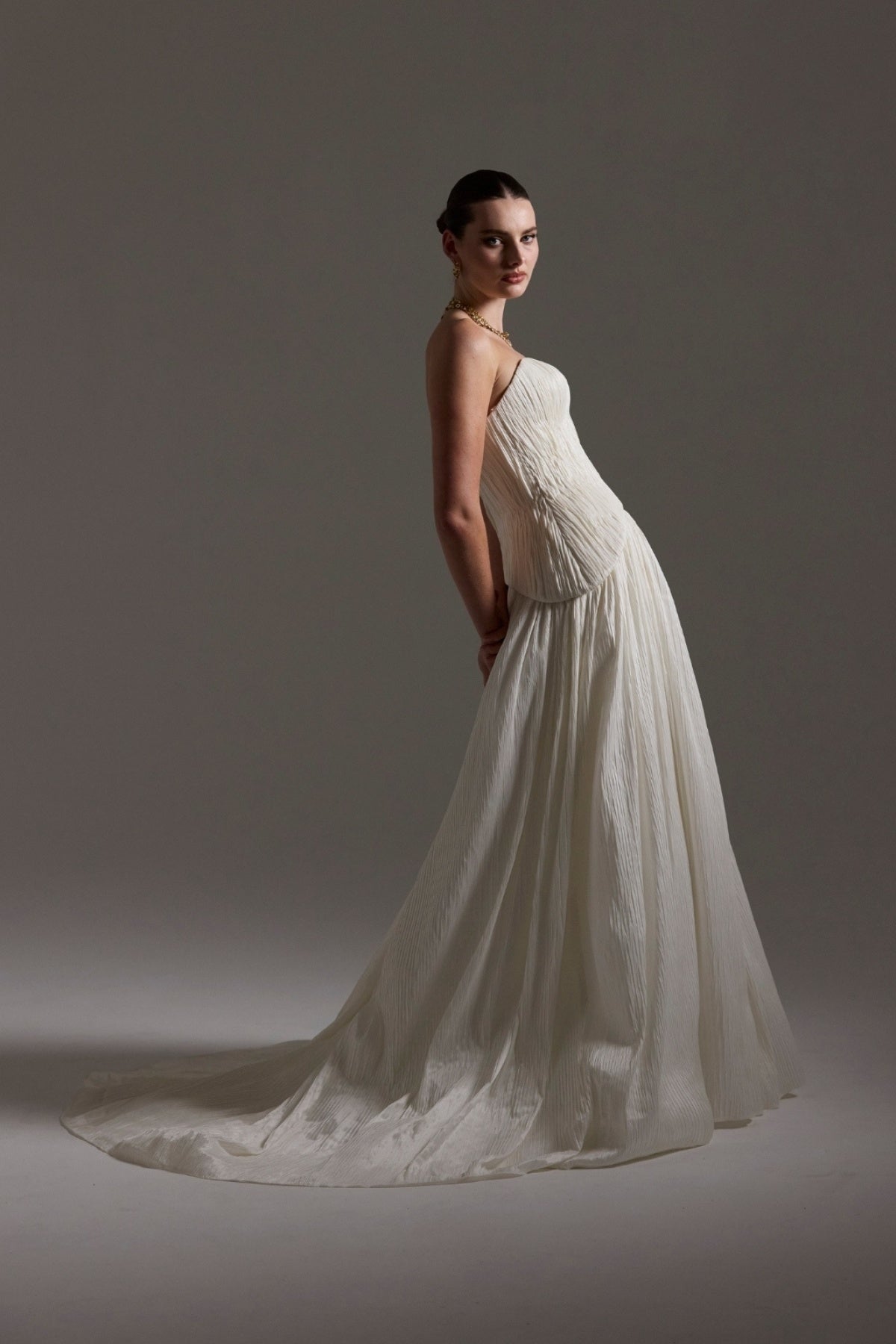 two-piece pleated taffeta wedding gown featuring a sweetheart neckline with a drop waist, A-line skirt. 