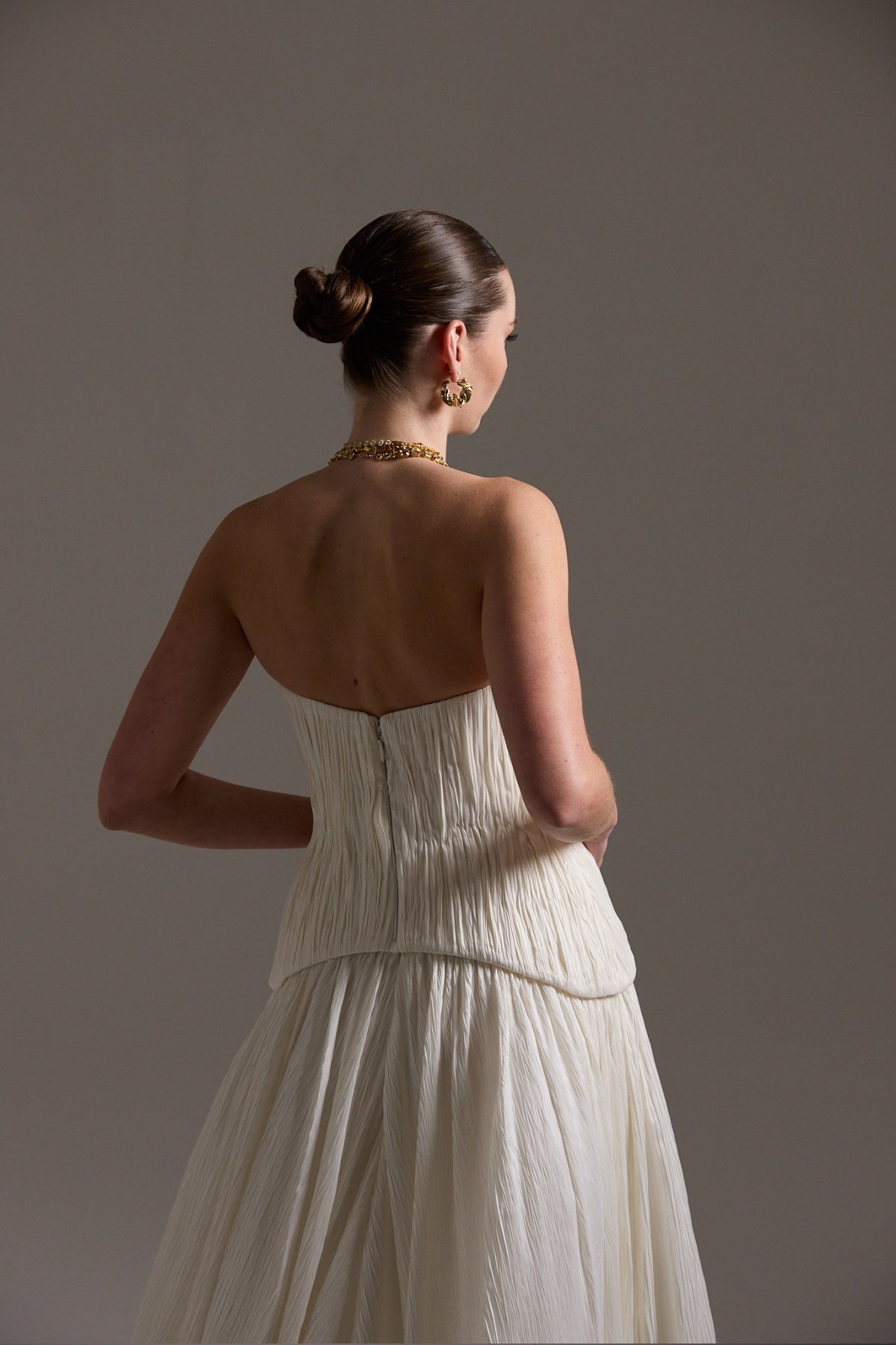 two-piece pleated taffeta wedding gown featuring a sweetheart neckline with a drop waist, A-line skirt. 