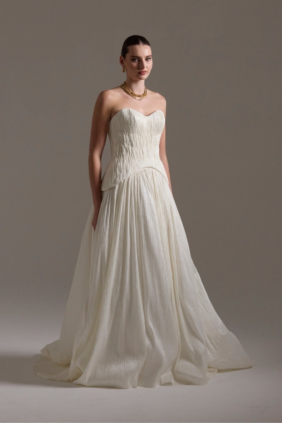 two-piece pleated taffeta wedding gown featuring a sweetheart neckline with a drop waist, A-line skirt. 