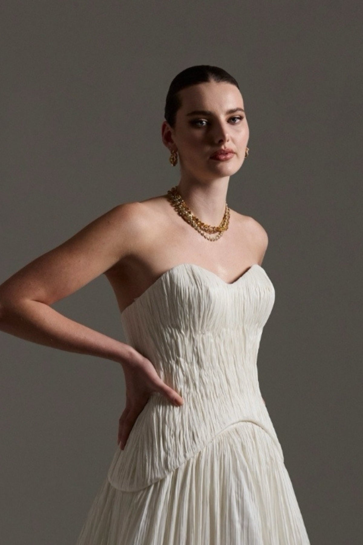 two-piece pleated taffeta wedding gown featuring a sweetheart neckline with a drop waist, A-line skirt. 