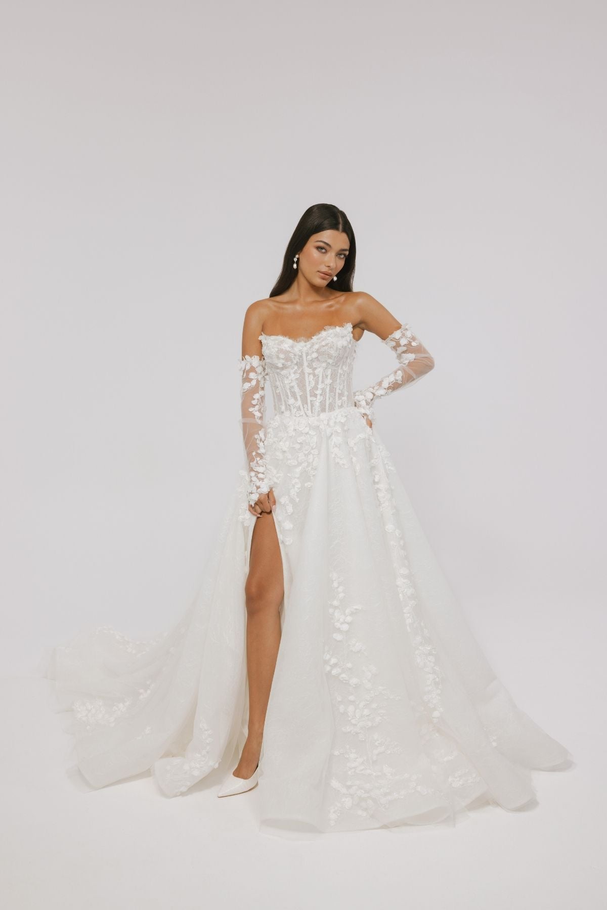 floral wedding gown with corseted bodice, A line skirt featuring split. paired with matching floral lace sleeves 