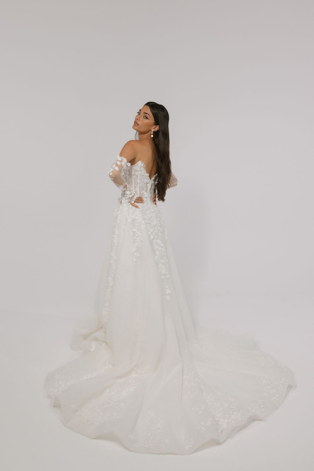 floral wedding gown with corseted bodice, A line skirt featuring split. paired with matching floral lace sleeves 