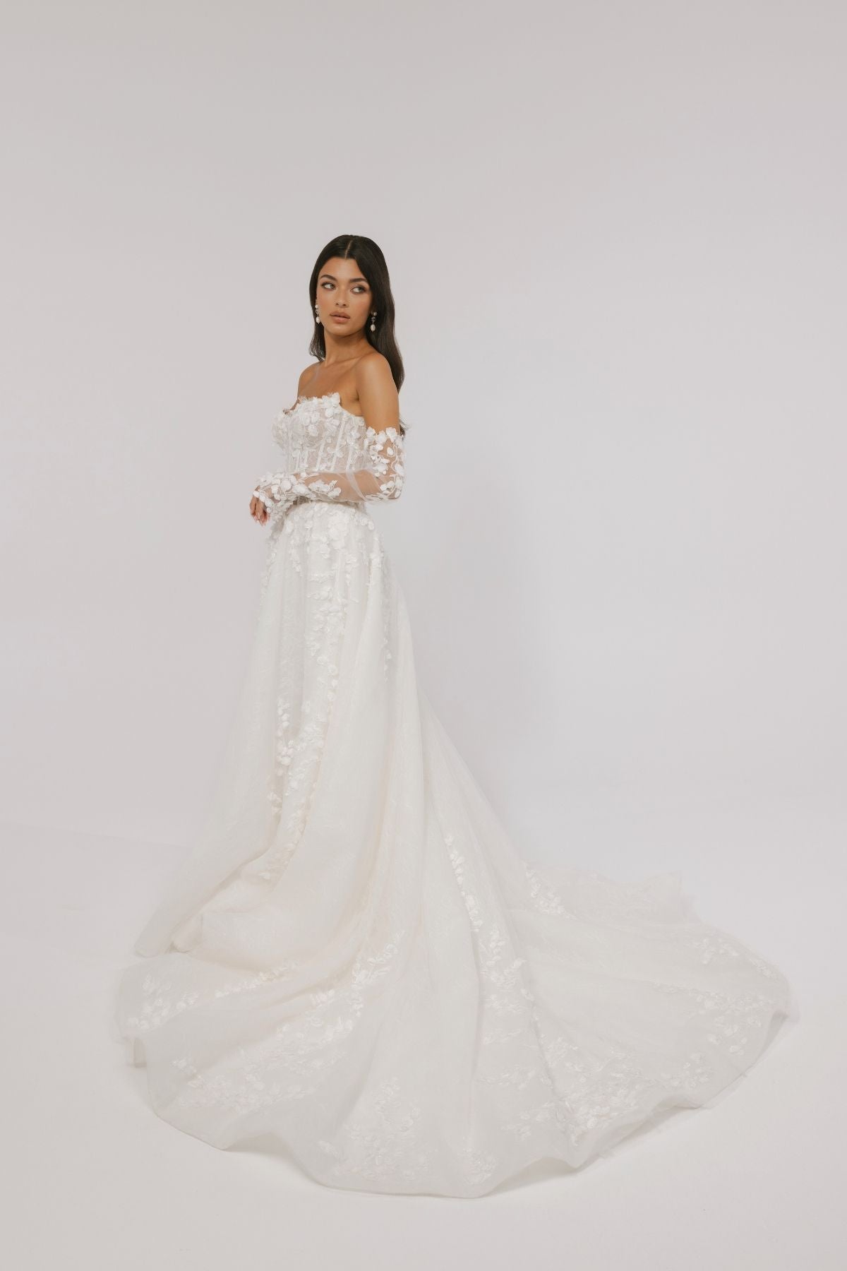 floral wedding gown with corseted bodice, A line skirt featuring split. paired with matching floral lace sleeves 