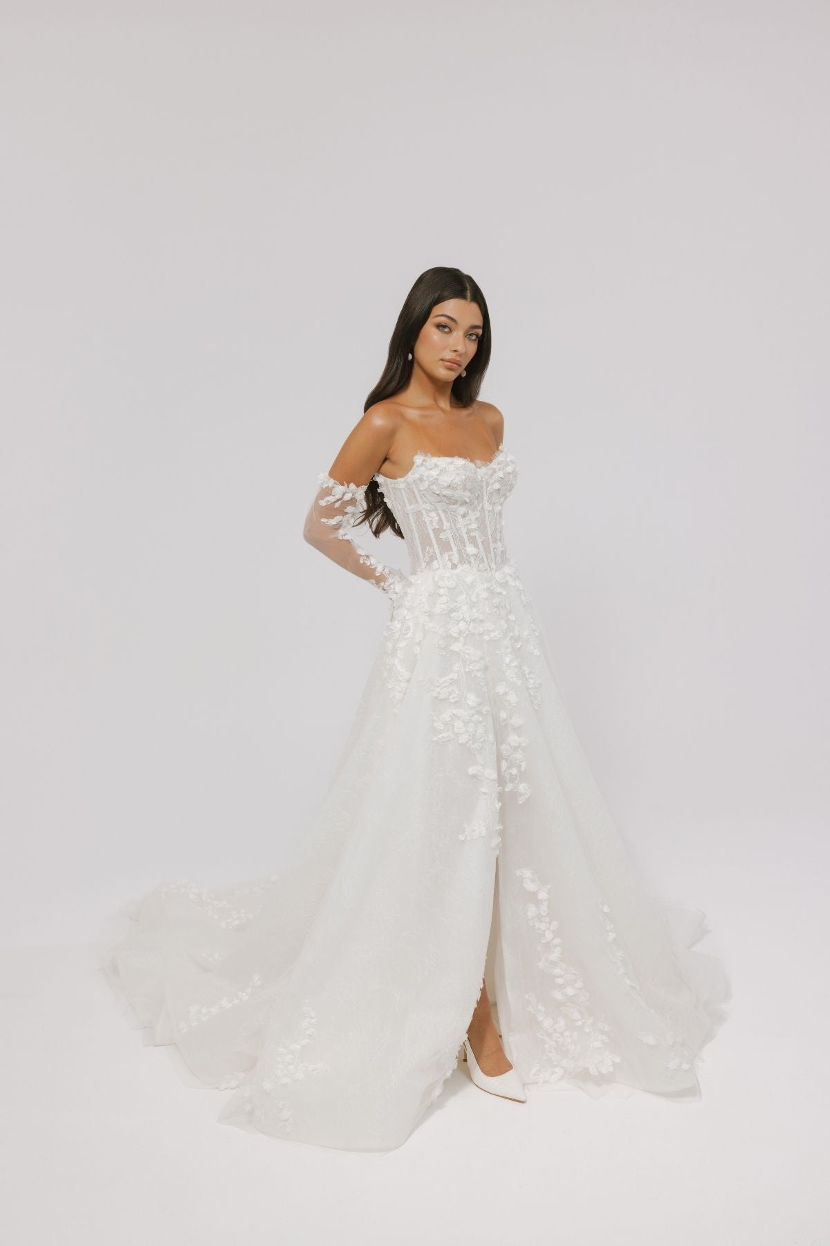 floral wedding gown with corseted bodice, A line skirt featuring split. paired with matching floral lace sleeves 