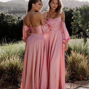 Front and back view of Violette bridesmaid gown with front split. Shown here in pink satin with detachable sleeves