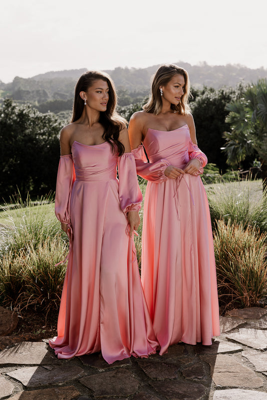 Violette bridesmaid gown in pink satin. Strapless bustier style with detachable sleeve and front split
