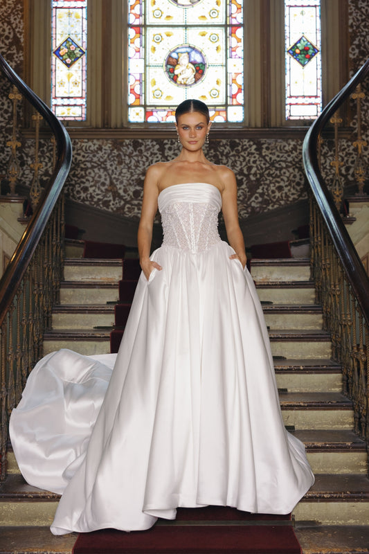 strapless A-line wedding gown with beaded pearl and crystal bodice, mikado fabric. 