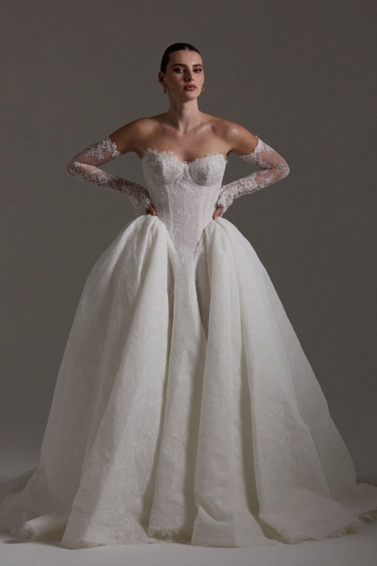 A line ballgown wedding dress with sweetheart neckline,  and deep basque waistline in chantilly lace 