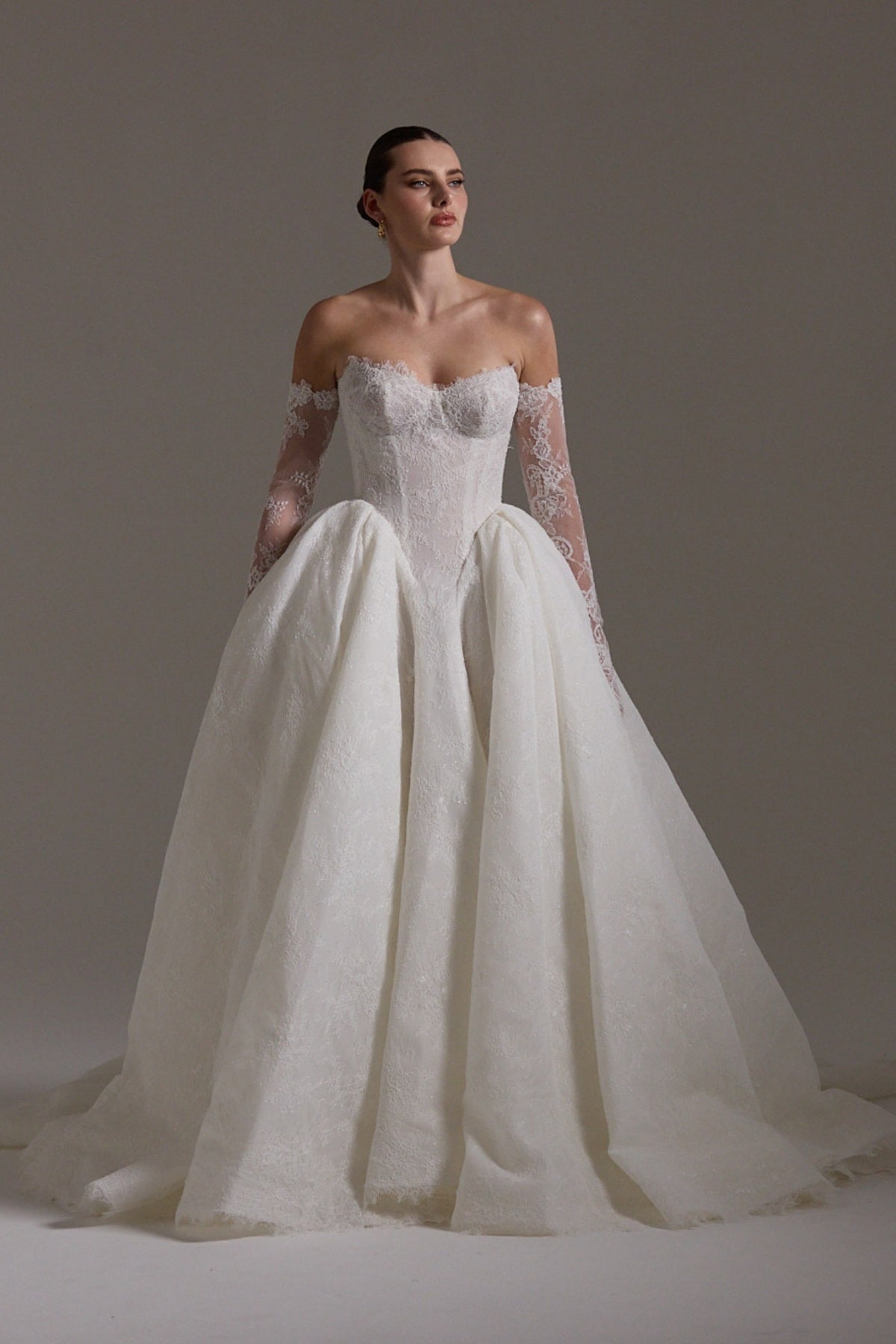 A line ballgown wedding dress with sweetheart neckline,  and deep basque waistline in chantilly lace 