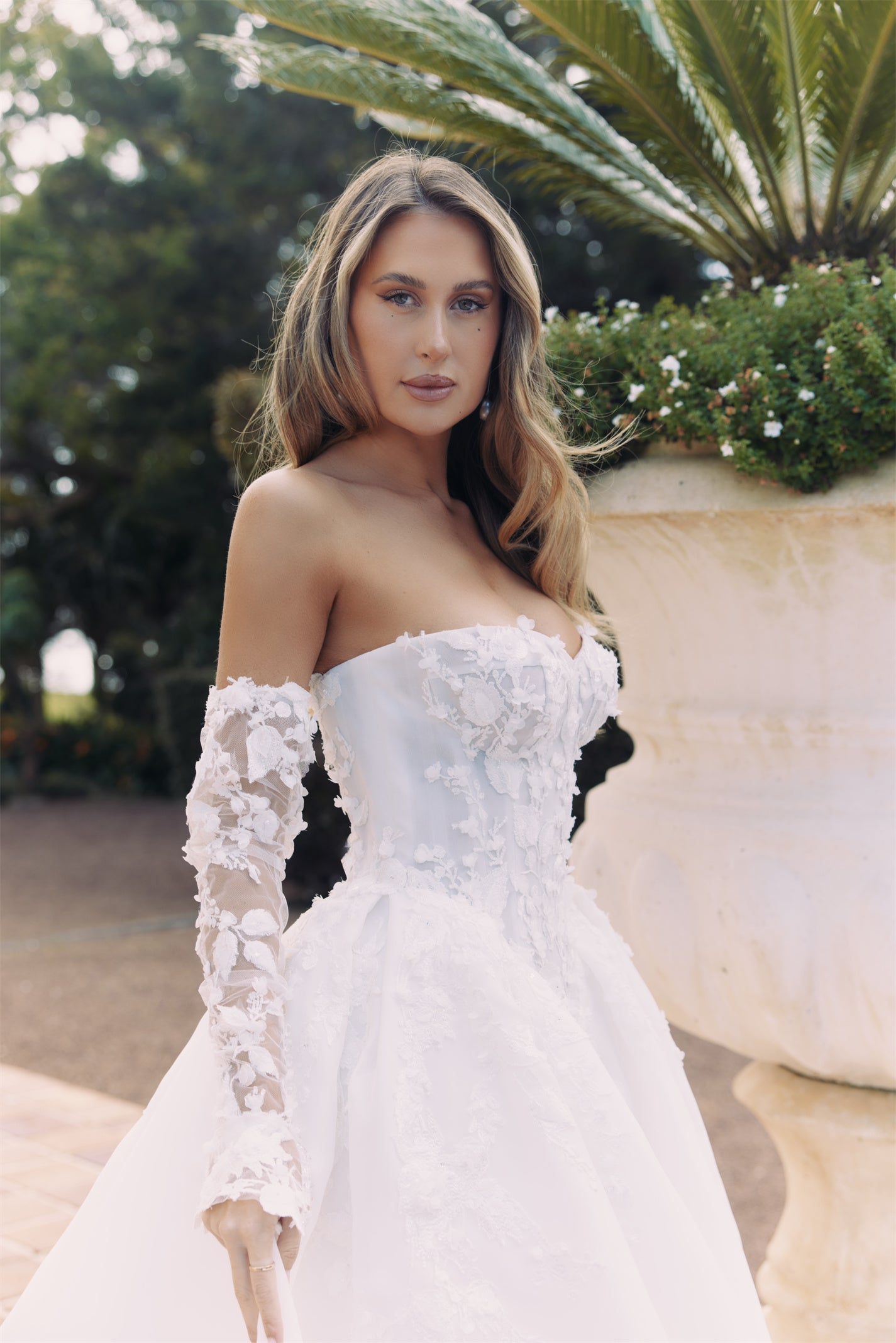 ARTEMIS Bridal gown - By Victoria Collection Jessica Couture, featuring an A-line Princess Ballgown covered in delicate leaf lace, Basque Waist and chapel train. 
