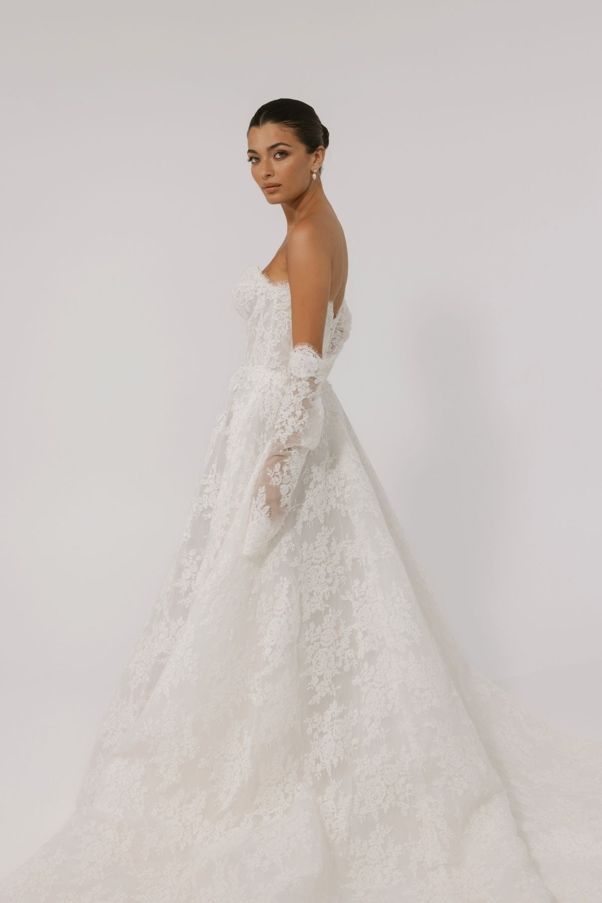 Lace A-line wedding gown with off the shoulder sleeves, dramatic chapel train 