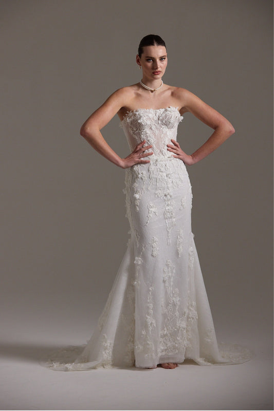 Fitted bridal gown with floral lace and strapless neckline 