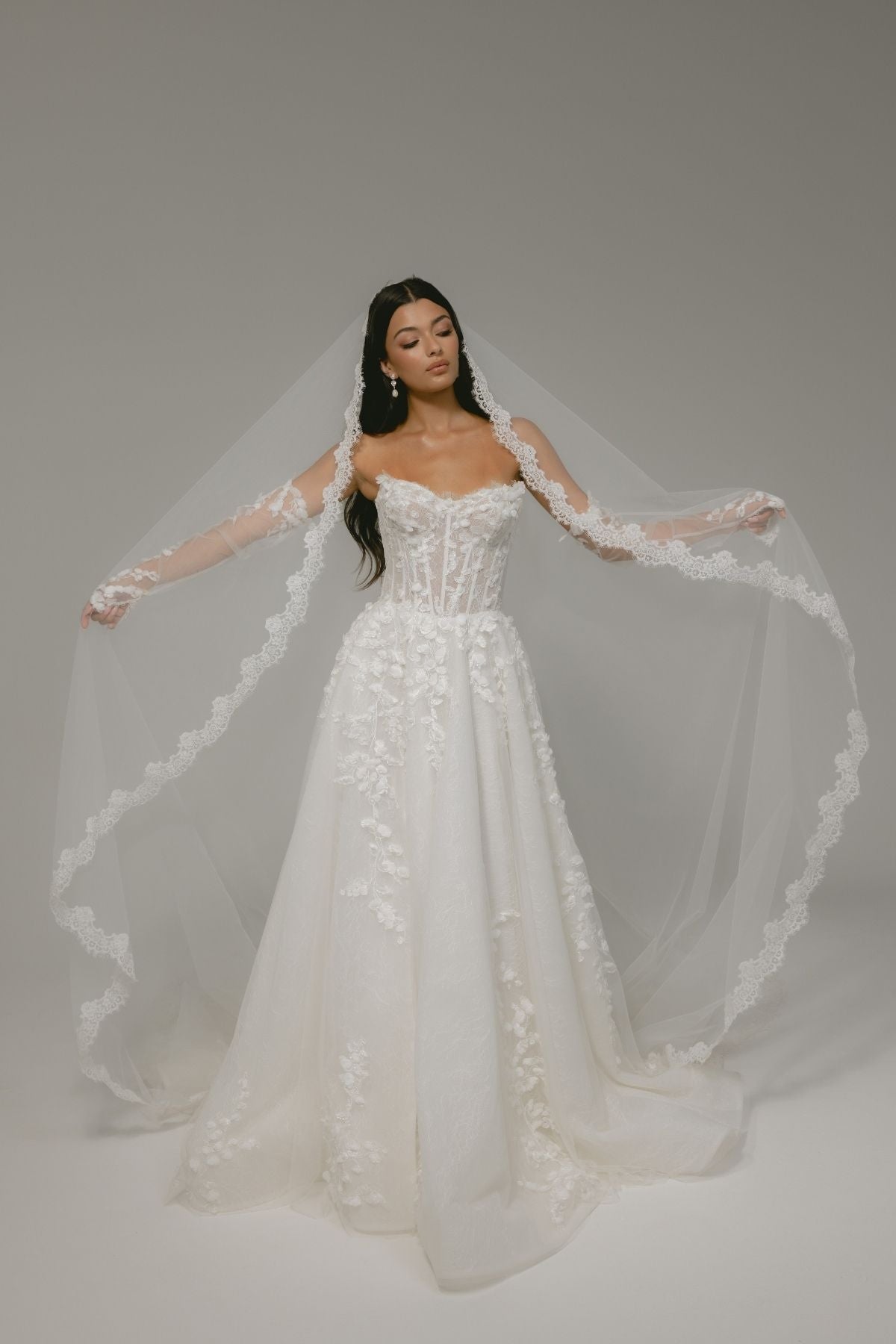 floral wedding gown with corseted bodice, A line skirt featuring split. paired with matching floral lace sleeves 