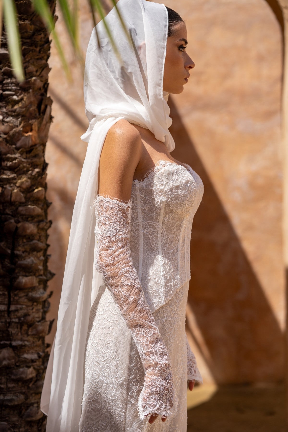 2-piece lace wedding gown, corset top and fitted skirt. paired with fitted sleeves 