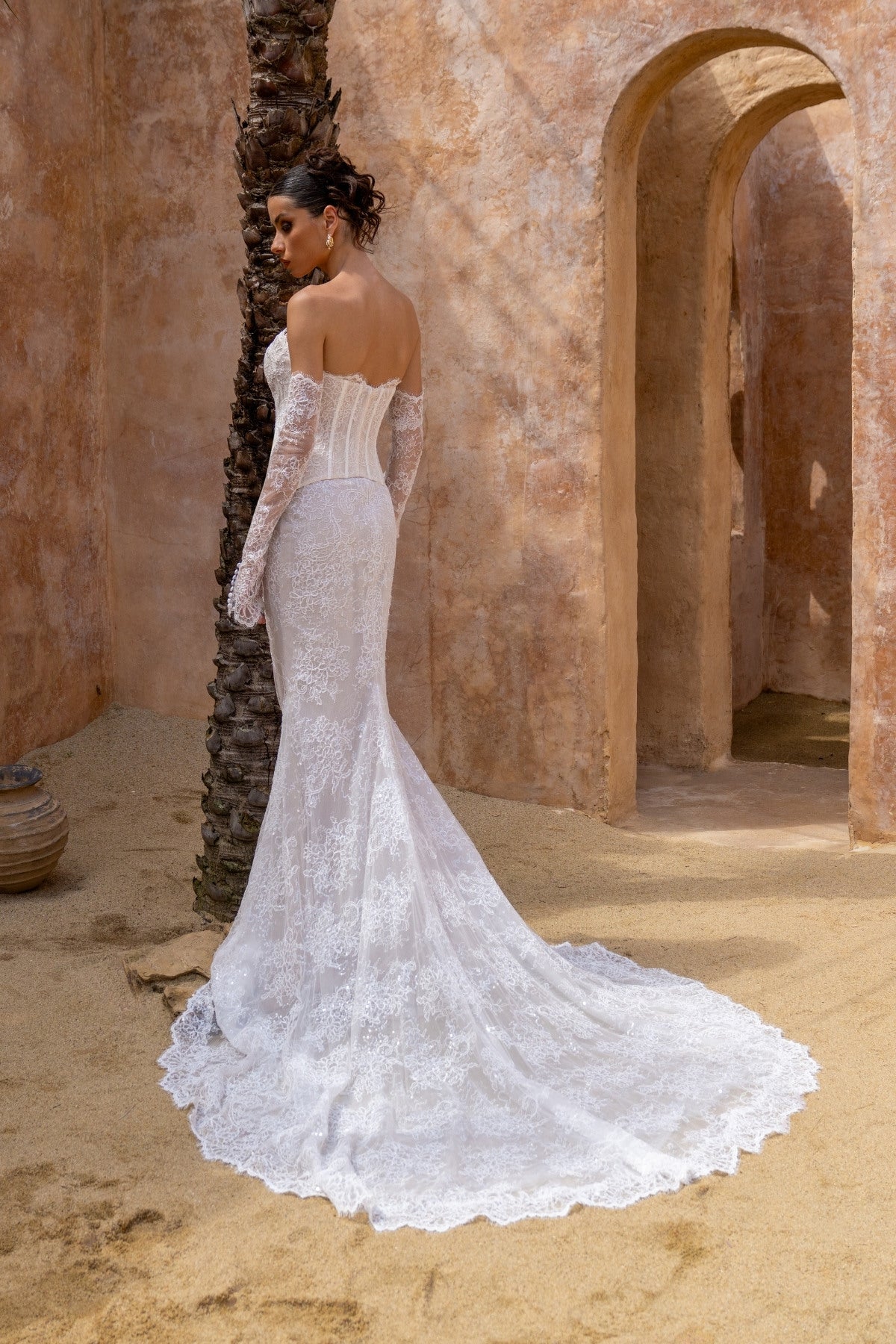 2-piece lace wedding gown, corset top and fitted skirt. paired with fitted sleeves 