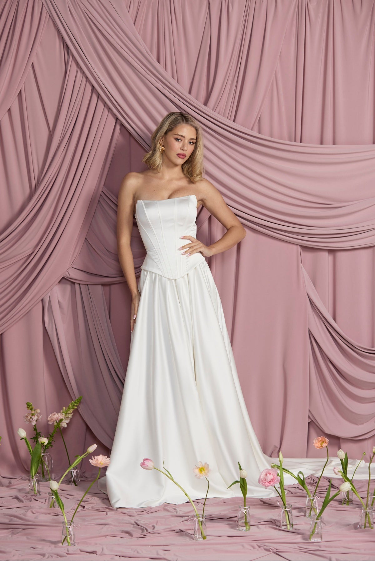 Structured satin corset with cat eye neckline and peplum hip panels