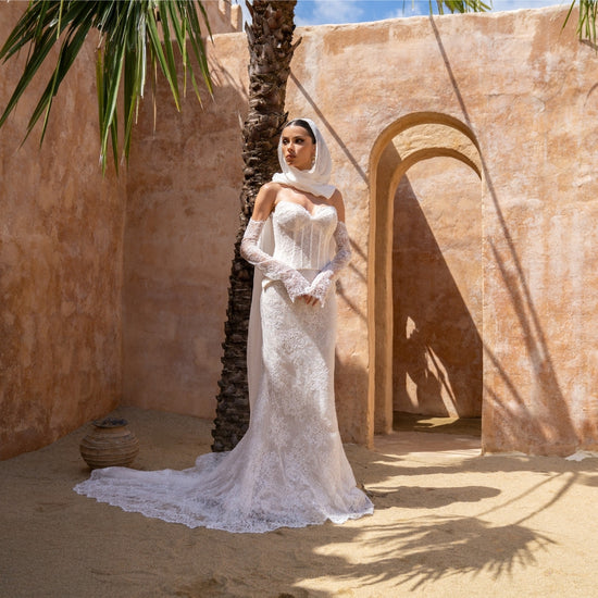 2-piece lace wedding gown, corset top and fitted skirt. paired with fitted sleeves 