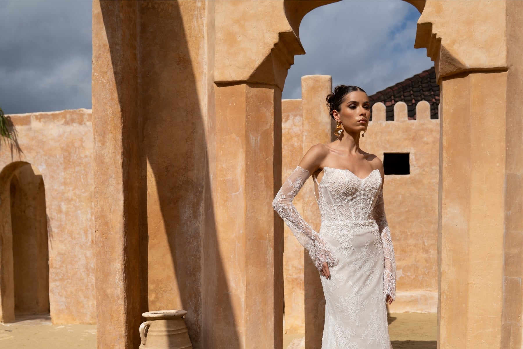 fitted lace wedding gown, with detachable fitted sleeves. 