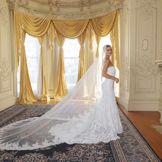 fitted lace wedding gown with sweetheart neckline and scalloped train 