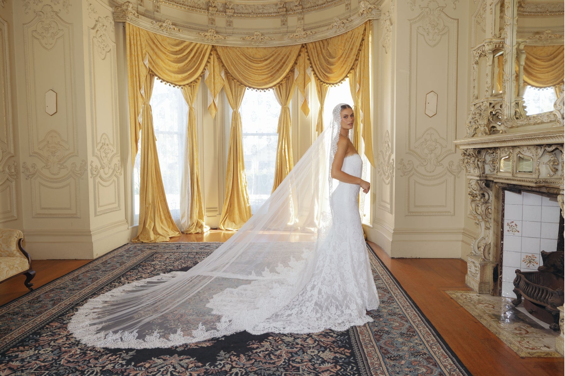 fitted lace wedding gown with sweetheart neckline and scalloped train 