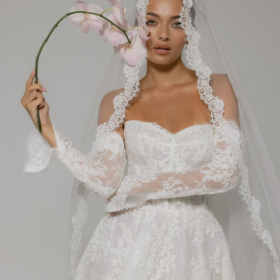 Lace A-line wedding gown with off the shoulder sleeves, dramatic chapel train 