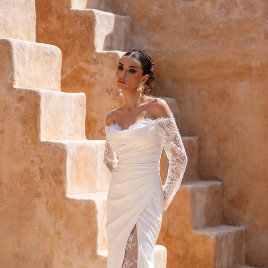 Fitted wedding dress, in plain crepe with lace covering the split. sweetheart neckline, complete with detachable fitted lace sleeves 