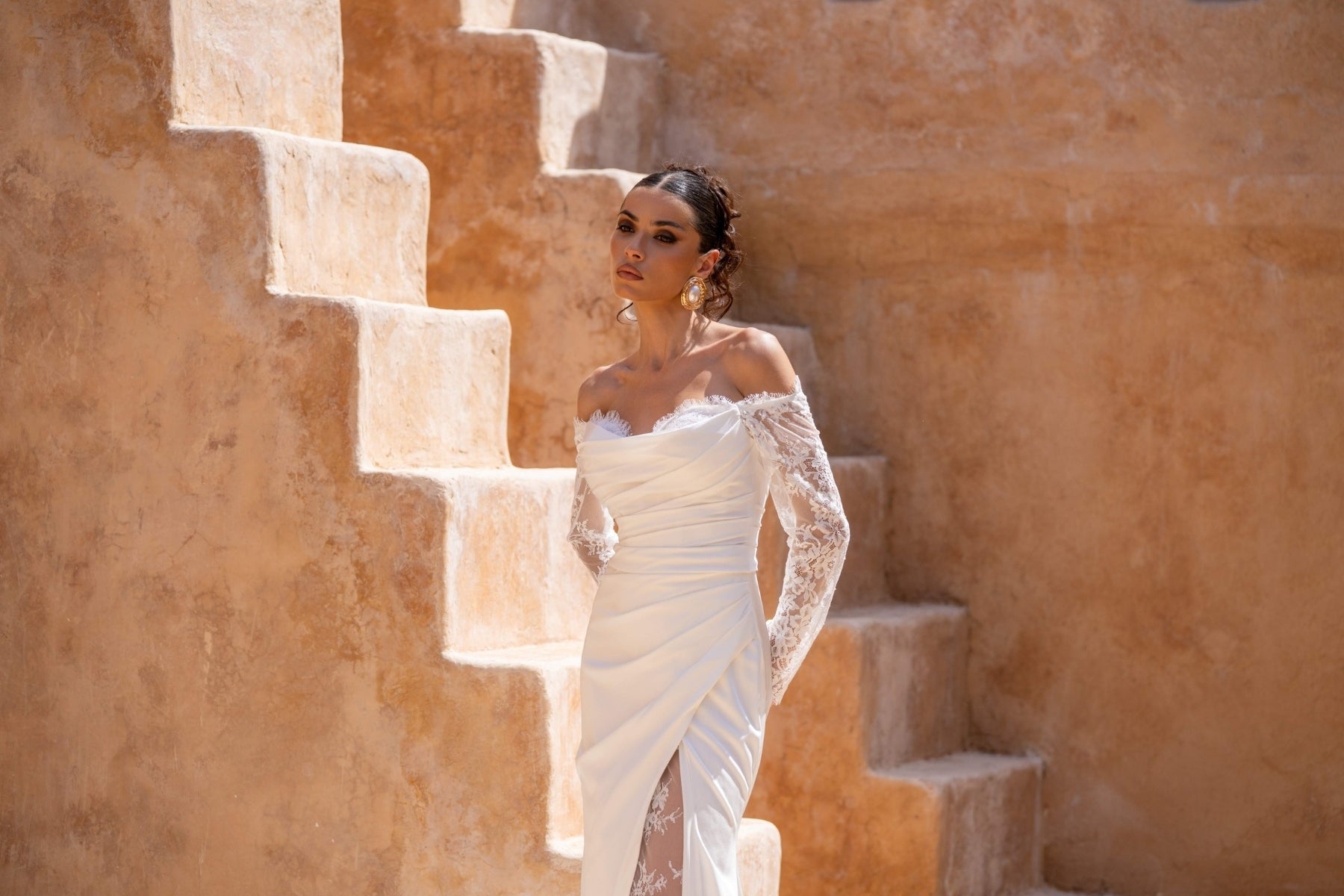 Fitted wedding dress, in plain crepe with lace covering the split. sweetheart neckline, complete with detachable fitted lace sleeves 