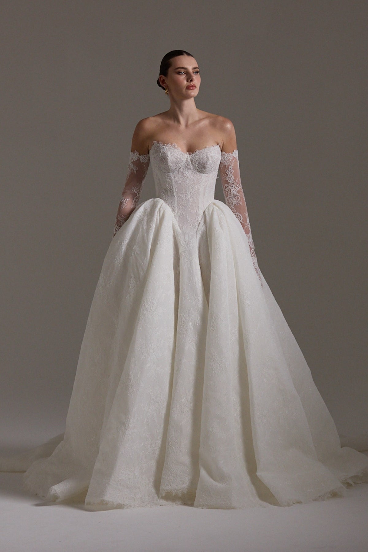 A line ballgown wedding dress with sweetheart neckline,  and deep basque waistline in chantilly lace 