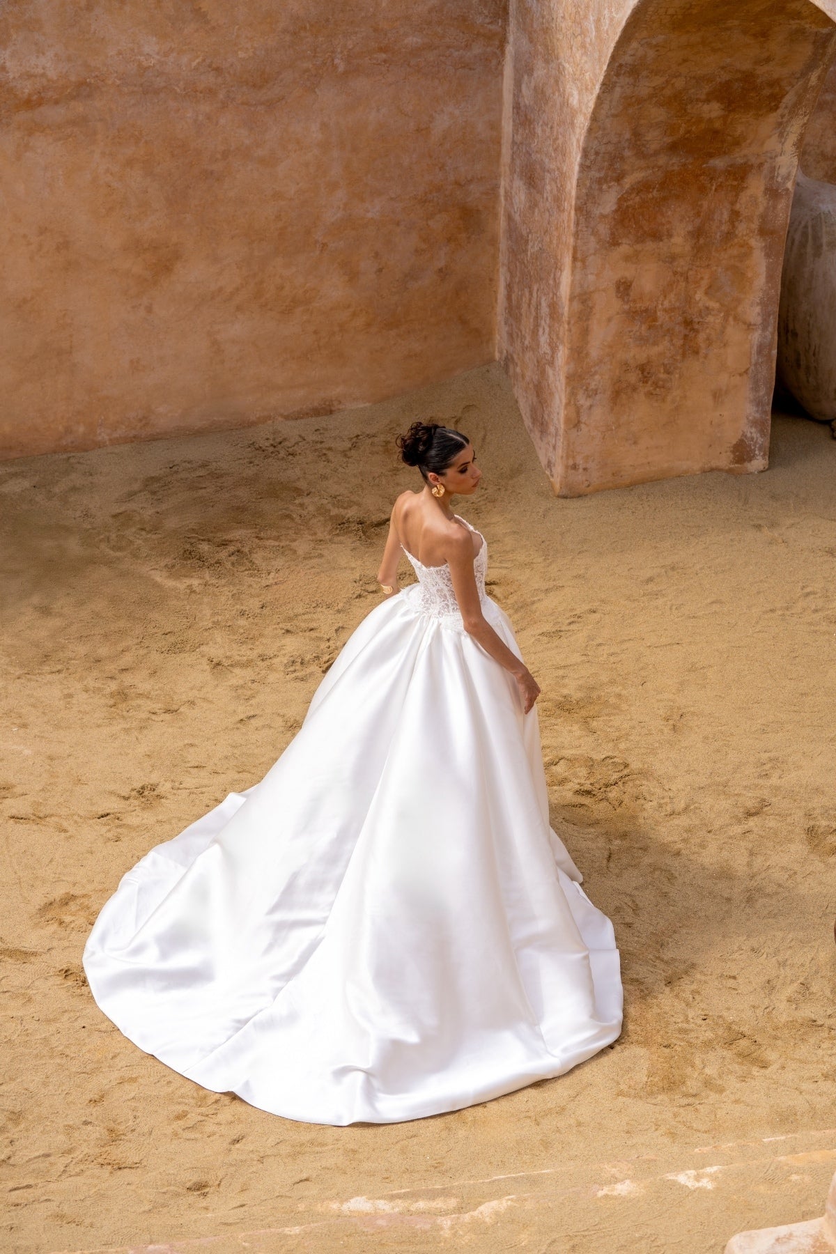 A-line wedding gown with lace bodice and plain skirt featuring basque waistline 