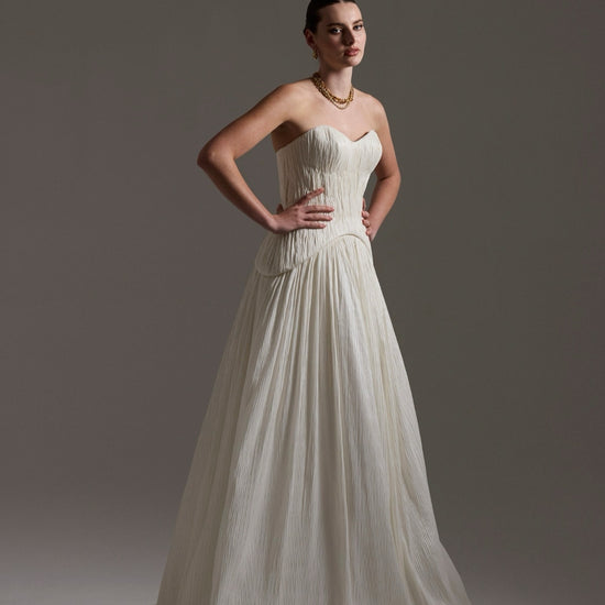 two-piece pleated taffeta wedding gown featuring a sweetheart neckline with a drop waist, A-line skirt. 