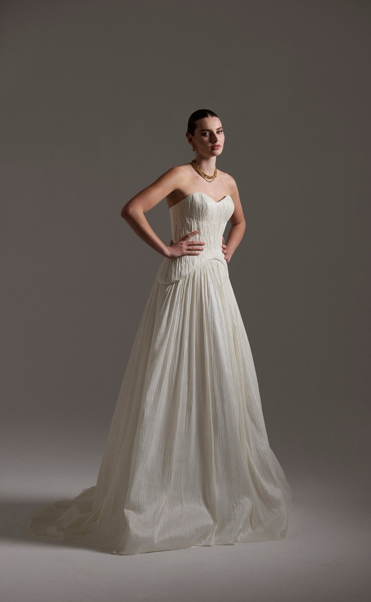 two-piece pleated taffeta wedding gown featuring a sweetheart neckline with a drop waist, A-line skirt. 