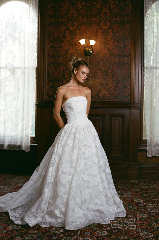 strapless A line wedding dress featuring floral lace organza. 