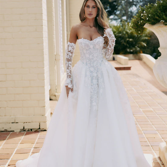 ARTEMIS Bridal gown - By Victoria Collection Jessica Couture, featuring an A-line Princess Ballgown covered in delicate leaf lace, Basque Waist and chapel train. 