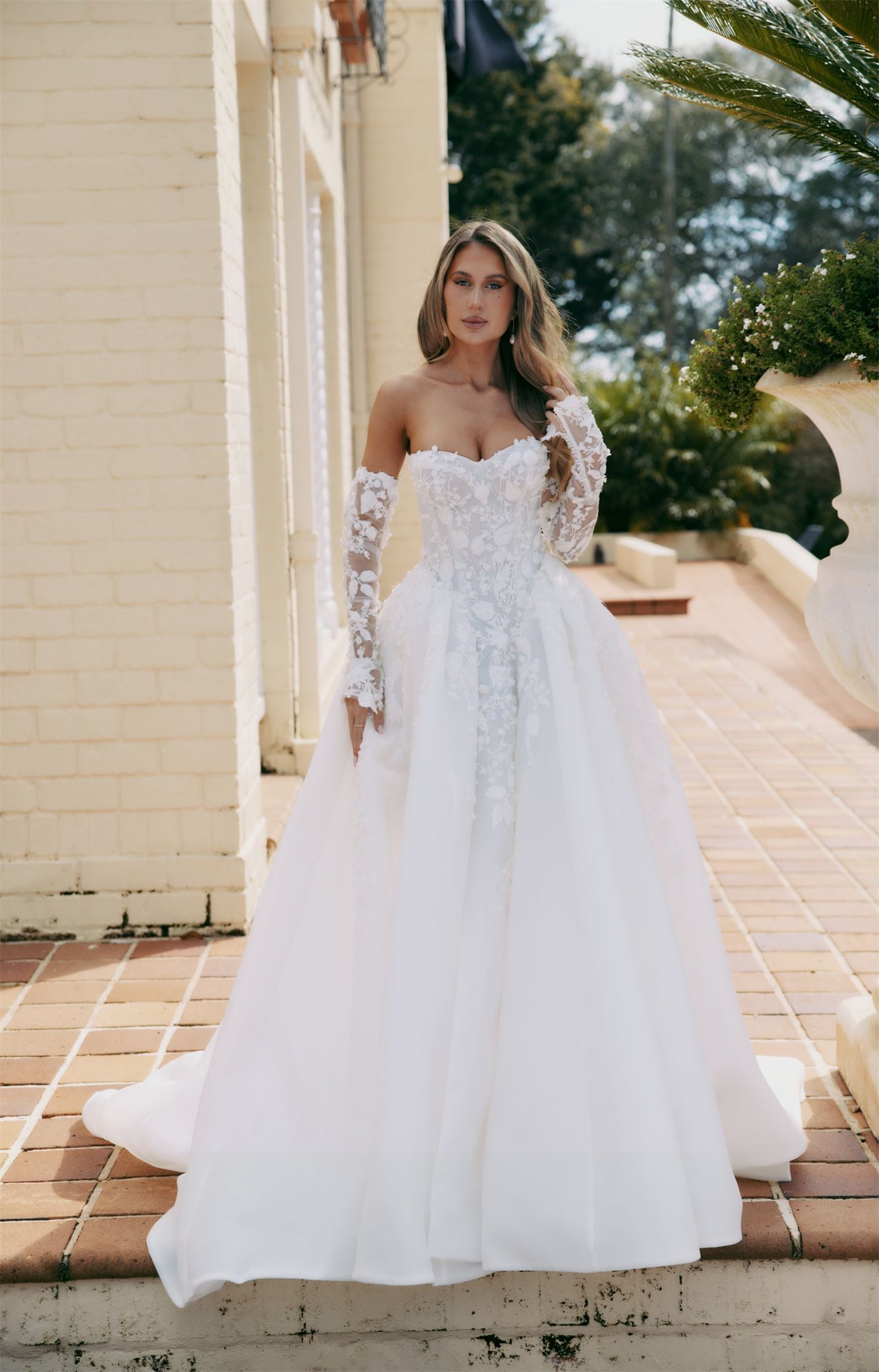 ARTEMIS Bridal gown - By Victoria Collection Jessica Couture, featuring an A-line Princess Ballgown covered in delicate leaf lace, Basque Waist and chapel train. 