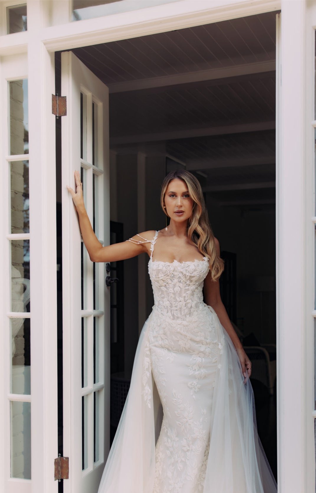 JOLIE Bridal Gown - Wedding dress by Victoria Collection Jessica Couture. Featuring an Fit-N-Flare floral lace gown with chapel train, and delicate pearl chains. 