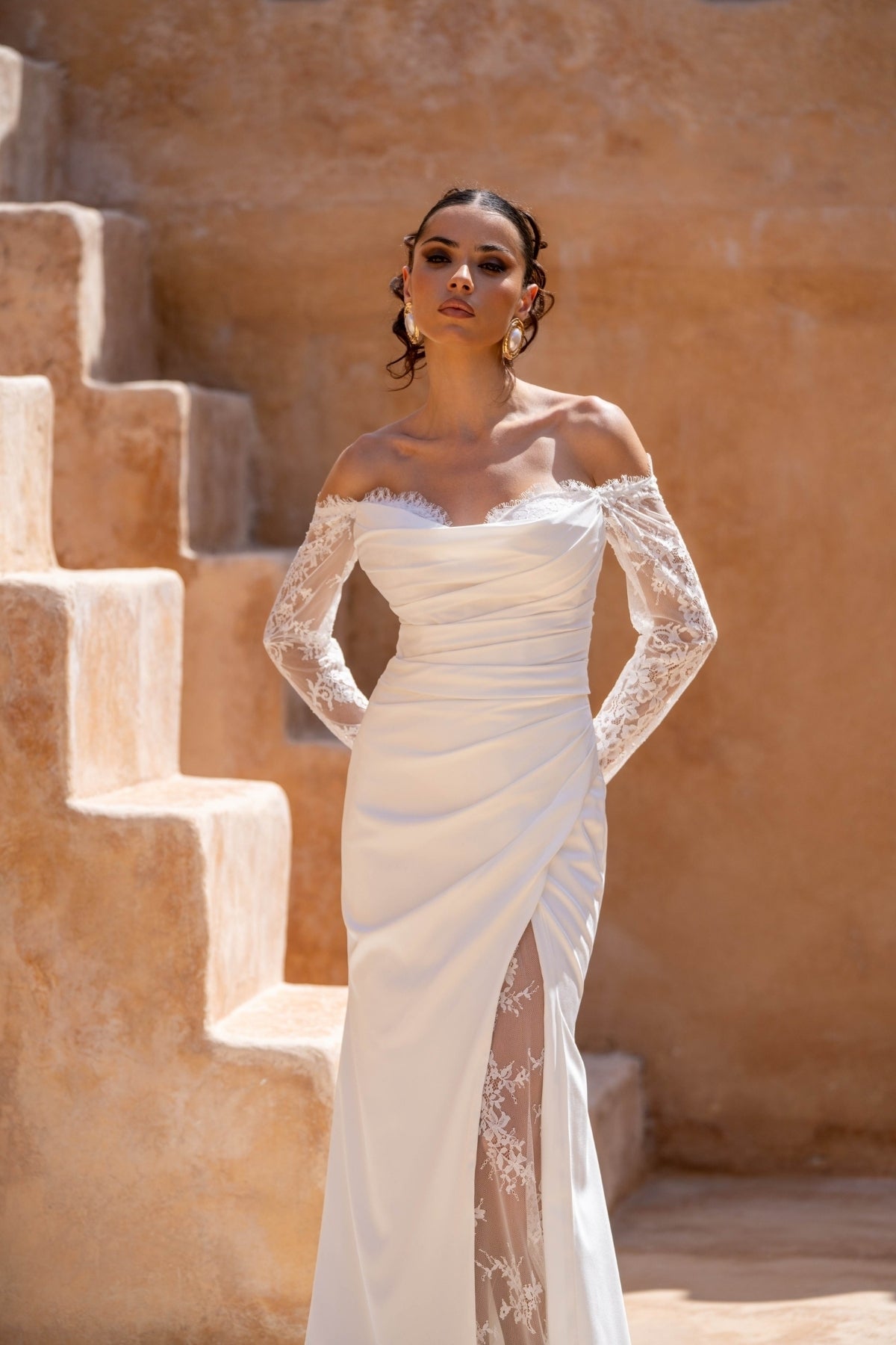Fitted wedding dress, in plain crepe with lace covering the split. sweetheart neckline, complete with detachable fitted lace sleeves 