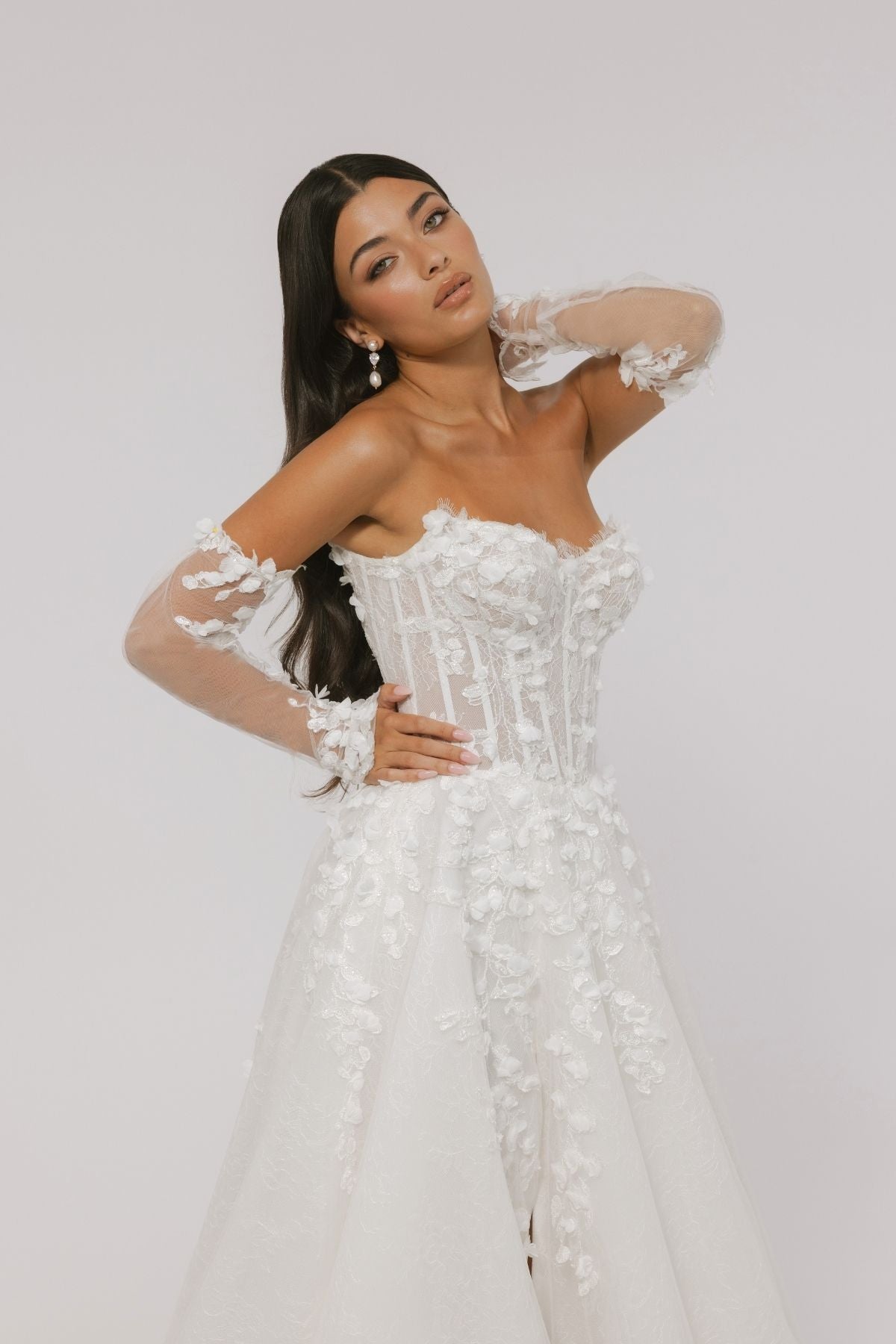 floral wedding gown with corseted bodice, A line skirt featuring split. paired with matching floral lace sleeves 