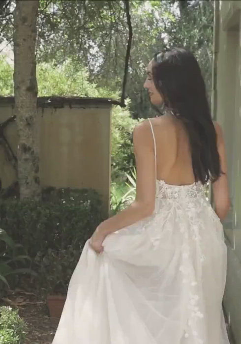 Model wearing Natasha high slit wedding gown