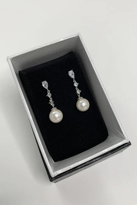 Diamante drop earrings with pearl at bottom.